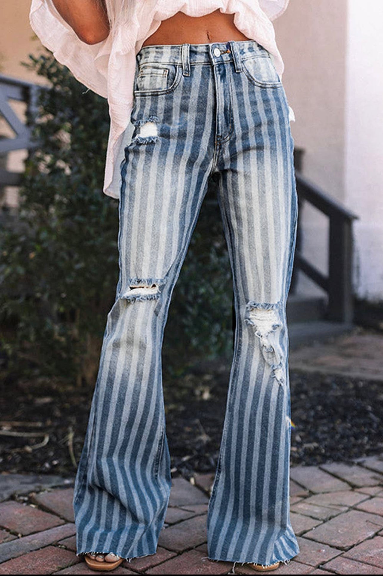 Striped denim distressed flare jeans